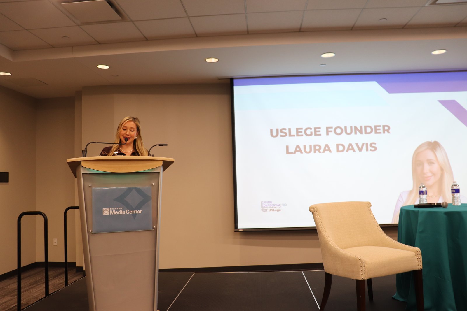 A title slide reading USLege Founder Laura Davis on screen at the Capitol Confidential Pro taping