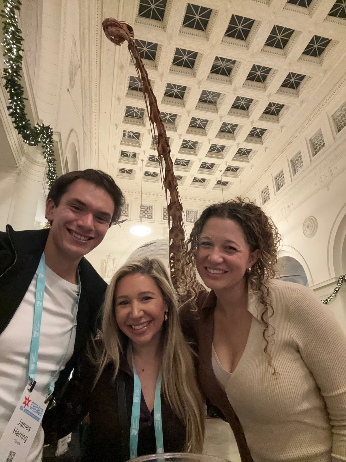 Three USLege team members posing together at the Field Museum during the CSG National Conference