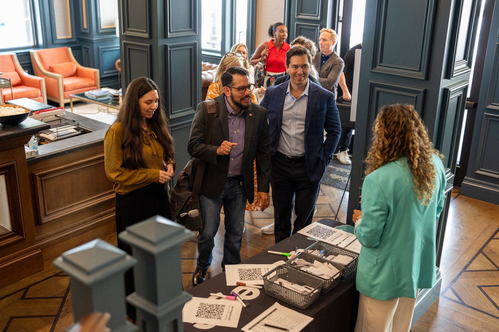 Attendees checking in at the registration table for the Texas Hackathon at the Joe B. Hogsett Theater