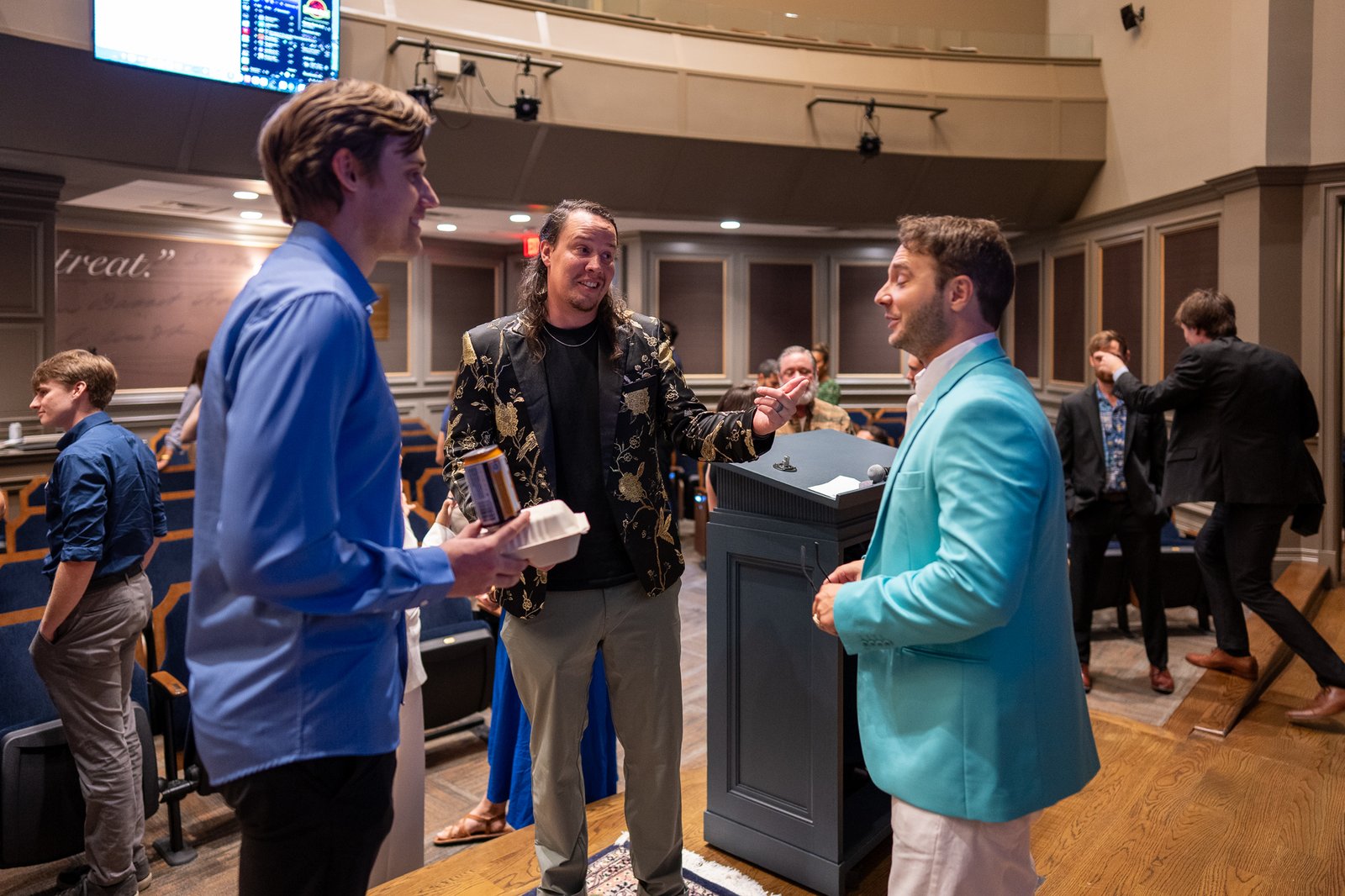 Guests networking and chatting after the Texas Hackathon pitch competition