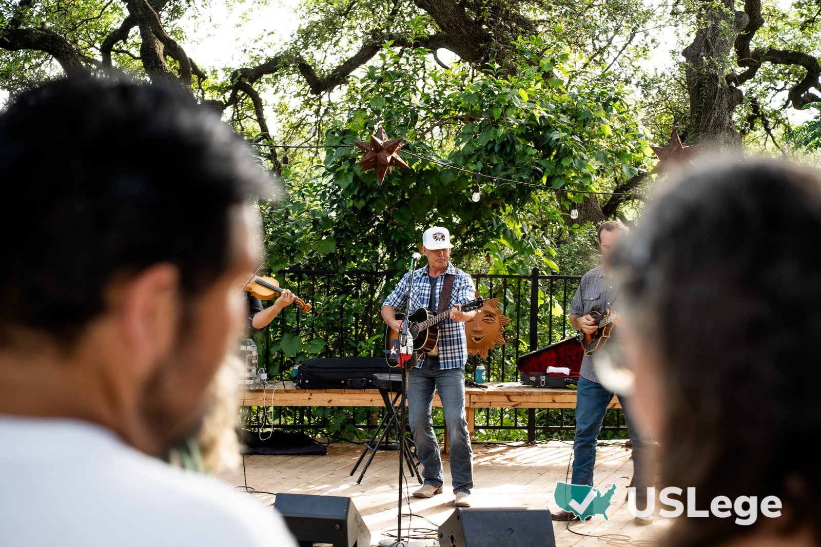 The lead singer performing live with his band at the Sine Die Celebration
