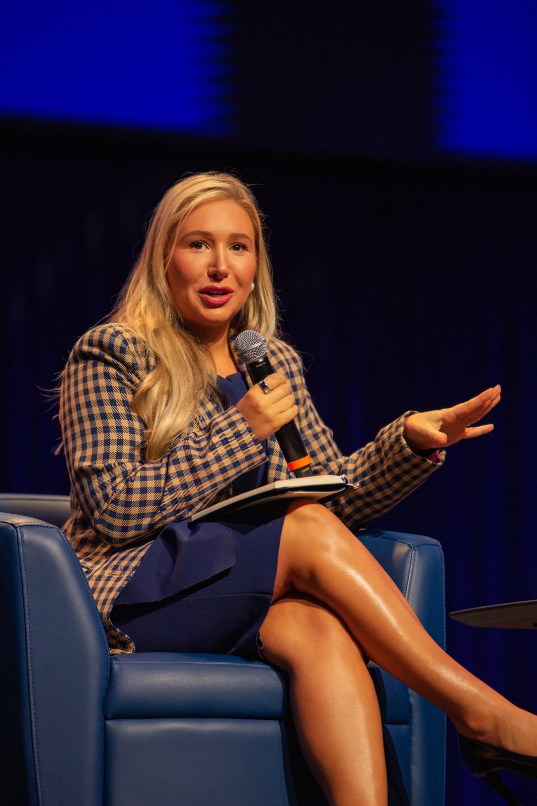Laura Davis speaking into a microphone on the Texas Dynamism panel