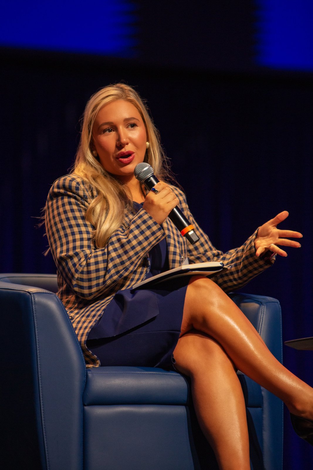 Laura Davis speaking on the Texas Dynamism panel, gesturing while she talks